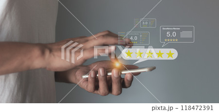Excellence Review, Young Man hand using smartphone mobile to five star review and give 5 stars Excellence Review, Young Man hand using smartphone mobile to five star review and give 5 stars 118472391