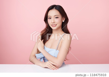 Beautiful young asian woman with clean fresh skin on pink background, Face care, Facial treatment, Cosmetology, beauty and spa, Asian women portrait. Beautiful young asian woman with clean fresh skin on pink background, Face care, Facial treatment, Cosmetology, beauty and spa, Asian women portrait. 118475910