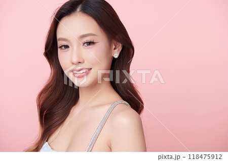 Beautiful young asian woman with clean fresh skin on pink background, Face care, Facial treatment, Cosmetology, beauty and spa, Asian women portrait. 118475912
