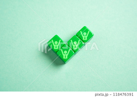 A green tick with symbols of jubilant team members. Achieve success. Get permission. Sign a profitable contract. Will complete the project, approve the work. Successful adoption. Team success 118476391