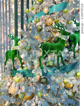 Card with reindeer decorating Christmas tree Card with reindeer decorating Christmas tree 118476528