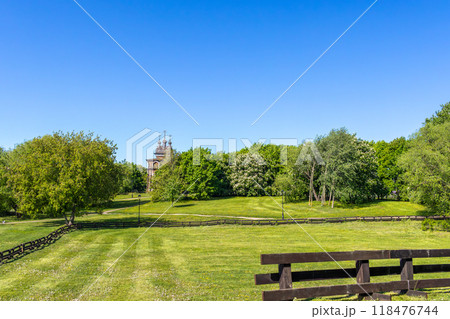 Spring green landscape with wooden temple and fence 118476744