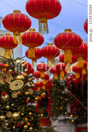 Red lanterns and decorated Christmas tree at Chinese New Year celebration in Moscow Red lanterns and decorated Christmas tree at Chinese New Year celebration in Moscow 118476894