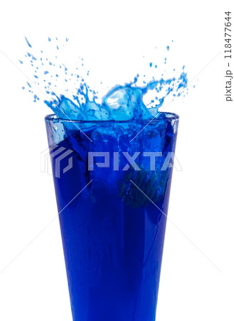 Blue cocktail or water splashes in glass isolated on the white 118477644