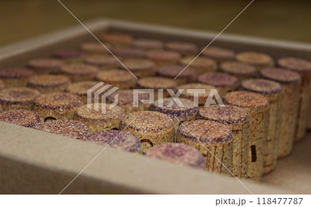 Closeup Angle View Of Neat Rows Of Natural Corks For Wine Bottles In A Packing Box  118477787
