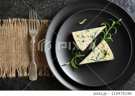 Blue cheese and rosemary on a blackstone table. Blue cheese and rosemary on a blackstone table. 118478196