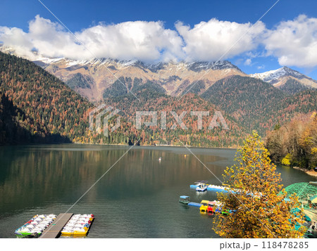 Lake Ritsa panoramic view at sunset in autumn. Lake Ritsa is a lake in the Caucasus Mountains in Abkhazia region, Georgia. Lake Ritsa panoramic view at sunset in autumn. Lake Ritsa is a lake in the Caucasus Mountains in Abkhazia region, Georgia. 118478285