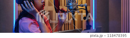 Recording Song in Professional Music Studio Booth 118478395