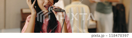 Singing Girl Wearing Headphones Holding Microphone Singing Girl Wearing Headphones Holding Microphone 118478397