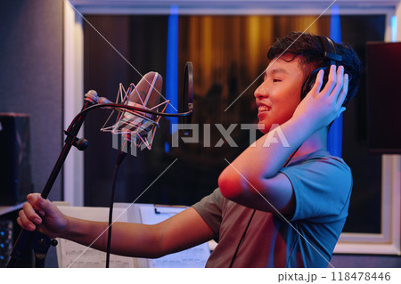 Recording Music with Microphone in Studio Setting Recording Music with Microphone in Studio Setting 118478446