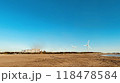 早朝の風力発電と鉄鋼工場 118478584
