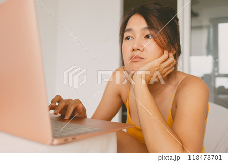 woman working with her laptop computer boring work from home. woman working with her laptop computer boring work from home. 118478701
