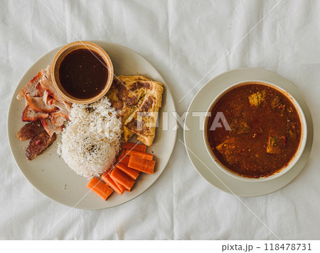Homemade set of Thai rice moo daeng and Sour Curry with Vegetable Omelet. Homemade set of Thai rice moo daeng and Sour Curry with Vegetable Omelet. 118478731