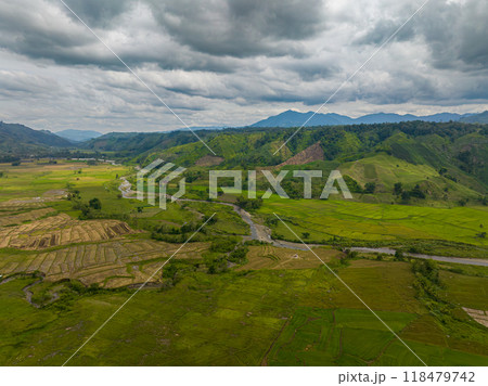 Paddy farm fields and wetlands. Blue sky and clouds. Mindanao, Philippines. 118479742