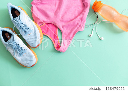Flat lay with sport equipment on light green background 118479921