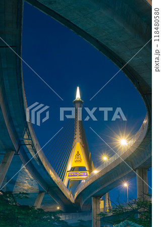 image captures stunning architecture of bridge at night, showcasing its illuminated structure and surrounding urban landscape. vibrant lights create captivating atmosphere image captures stunning architecture of bridge at night, showcasing its illuminated structure and surrounding urban landscape. vibrant lights create captivating atmosphere 118480580