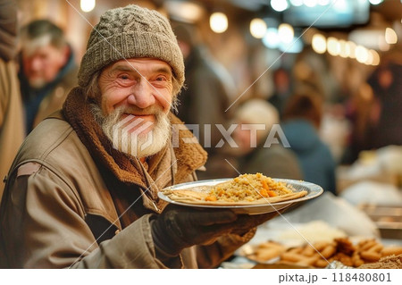 A homeless man eats in the canteen of the shelter 118480801