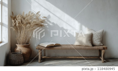 Cozy reading nook featuring a rustic bench, plants, and natural light streaming in Cozy reading nook featuring a rustic bench, plants, and natural light streaming in 118480945