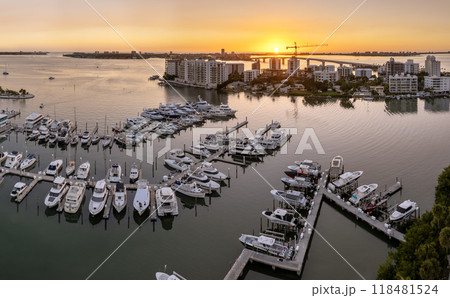 Sarasota Bay marina with luxury yachts and Florida city architecture at sunset. High-rise office buildings in downtown district. Real estate development in Florida. USA travel destination 118481524