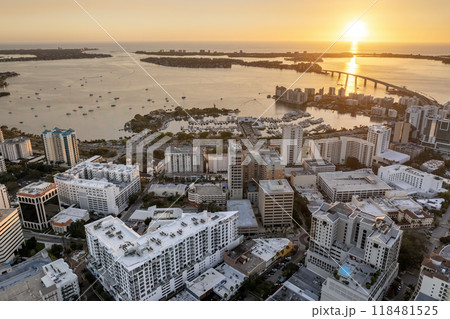 Sarasota Bay marina with luxury yachts and Florida city architecture at sunset. High-rise office buildings in downtown district. Real estate development in Florida. USA travel destination 118481525