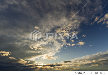 Fantastic panorama view of bright white gray dark wide puffy clouds lit by sun spreading against deep blue sky moving with wind. Beauty and power of nature, meteorology and climate changing concept. 118481807