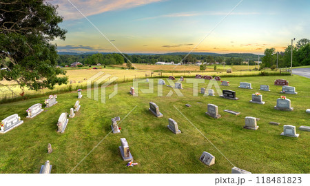 Graveyard burial place with many tombstones at small American church yard 118481823
