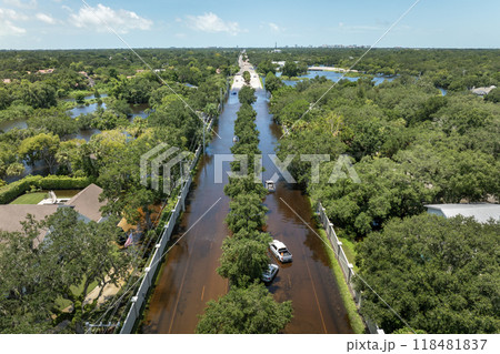Hurricane Debby flooded city street with trapped car submerged under water in Florida residential area. Consequences of natural disaster Hurricane Debby flooded city street with trapped car submerged under water in Florida residential area. Consequences of natural disaster 118481837