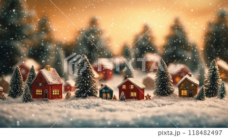 Snow-covered village with clock tower nestled in mountains during winter season 118482497