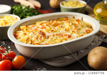 Concept of tasty and delicious homemade food - potato casserole Concept of tasty and delicious homemade food - potato casserole 118487736