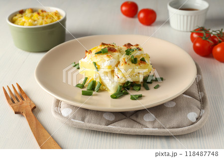 Concept of tasty and delicious homemade food - potato casserole Concept of tasty and delicious homemade food - potato casserole 118487748