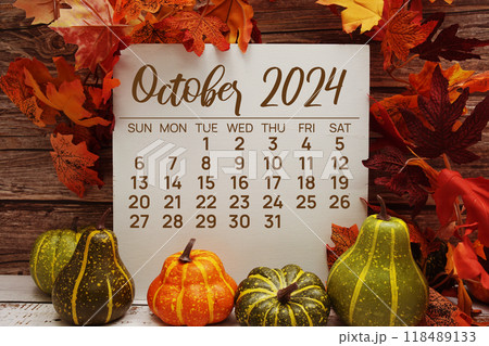 Autumn maple leaves decoration with wooden white board easel empty mockup space for text 118489133