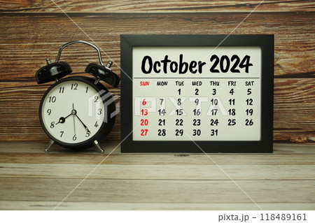 OCTOBER 2024 monthly calendar for planning and management concept with alarm clock on wooden background OCTOBER 2024 monthly calendar for planning and management concept with alarm clock on wooden background 118489161