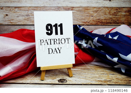 911 Patriot Day text messege with USA flag on wooden background 911 Patriot Day text messege with USA flag on wooden background 118490146