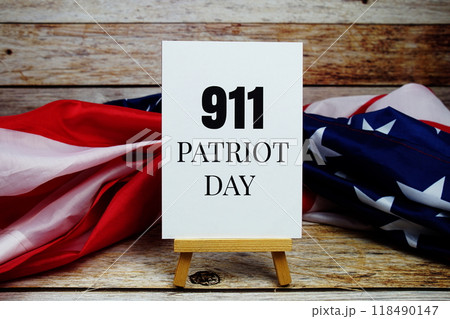 911 Patriot Day text messege with USA flag on wooden background 911 Patriot Day text messege with USA flag on wooden background 118490147