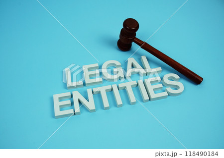Legal Entities alphabet letters with wooden judge gavel on blue background Legal Entities alphabet letters with wooden judge gavel on blue background 118490184