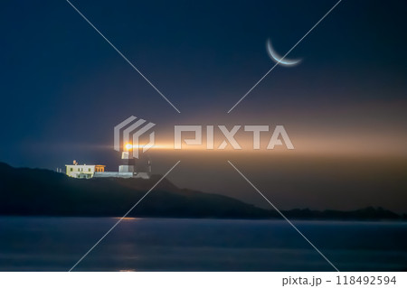 Crescent Moon and Lighthouse, Night Seascape. Crescent Moon and Lighthouse, Night Seascape. 118492594