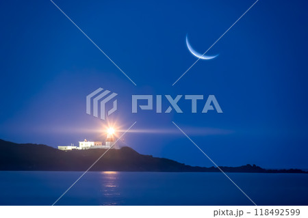 Crescent Moon and Lighthouse, Night Seascape. 118492599