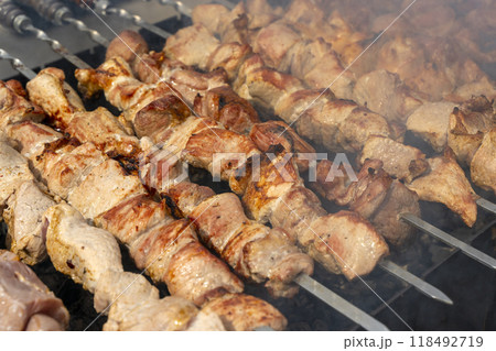 Kebab skewer meat dish. BBQ meat on grill. Kebab skewer meat dish. BBQ meat on grill. 118492719