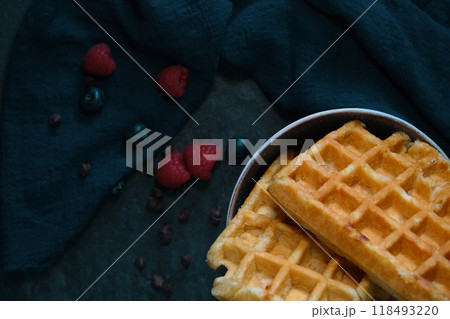 Belgian waffles on a dark background Belgian waffles on a dark background 118493220