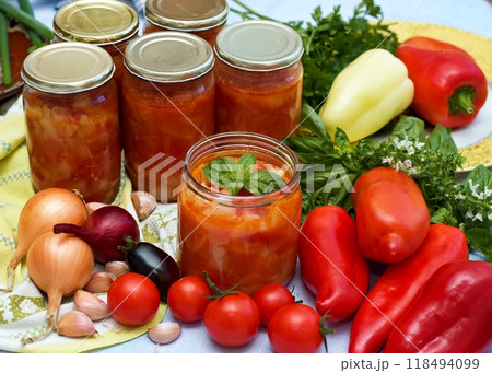 Homemade canned tomato and pepper salsa sauce. 118494099