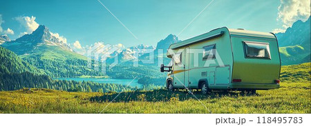 Campervan parked on shore of clear mountain lake, campsite and camper van with beautiful natural landscape, eco-friendly holiday camping banner with copy space 118495783