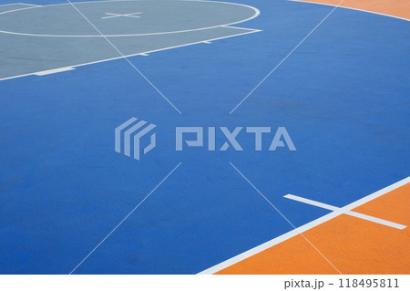 Blue and orange basketball court with white markings. Outdoor sports concept 118495811