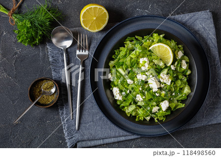 Classic Greek green lettuce salad with feta cheese 118498560