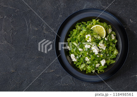 Classic Greek green lettuce salad with feta cheese 118498561