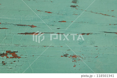 The wood is of an old texture, covered with green paint. The surface of a flat object. Wallpaper, background. 118501341
