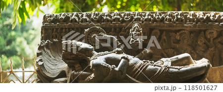 Ancient Statue Sheshashayi Or Shesha Also Known Like Sheshanaga Is Serpentine Demigod -naga- And King Of Serpents -nagaraja-. God Vishnu Is Resting On Shesha, Accompanied By His Consort Lakshmi 118501627