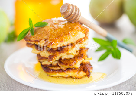 fried pancakes with apples and honey fried pancakes with apples and honey 118502075