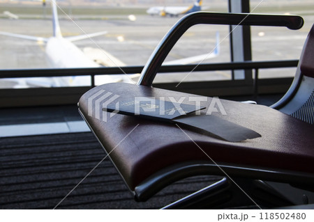 The Ukrainian biometric passport on the waiting place in the airport The Ukrainian biometric passport on the waiting place in the airport 118502480