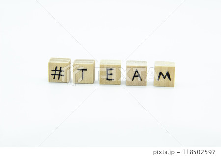 Word TEAM written on the wood cubes on white  background. The concept photo with letters #team 118502597