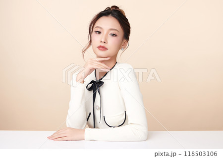 Beautiful young asian woman with clean fresh skin on beige background, Face care, Facial treatment, Cosmetology, beauty and spa, Asian women portrait. Beautiful young asian woman with clean fresh skin on beige background, Face care, Facial treatment, Cosmetology, beauty and spa, Asian women portrait. 118503106